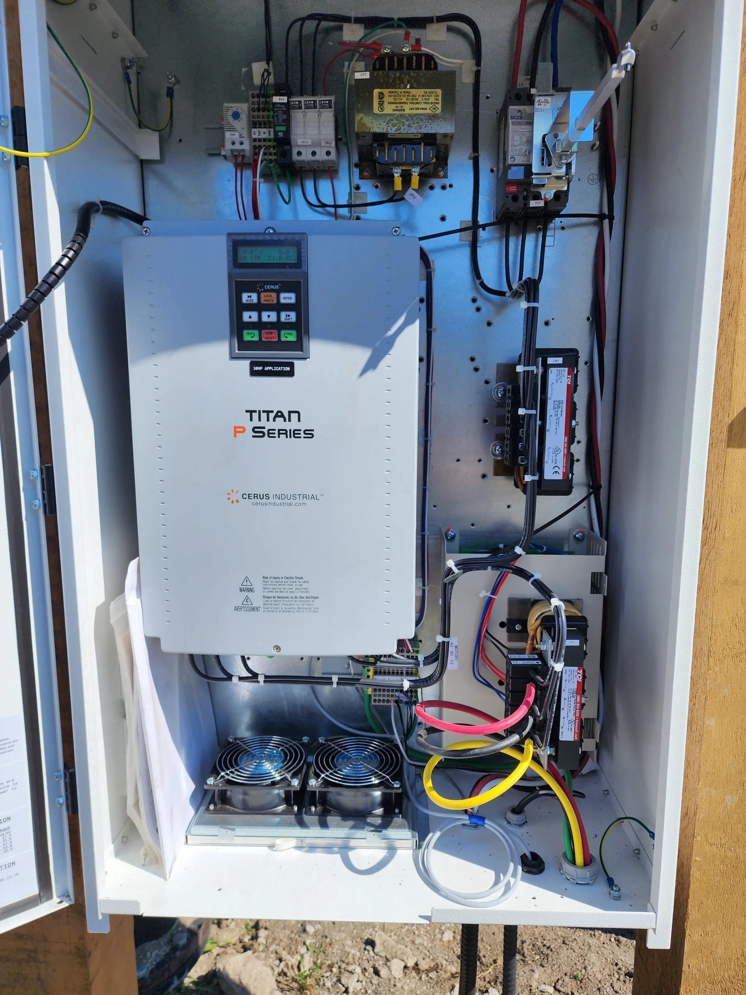 Variable frequency drive wired inside an irrigation pump control panel
