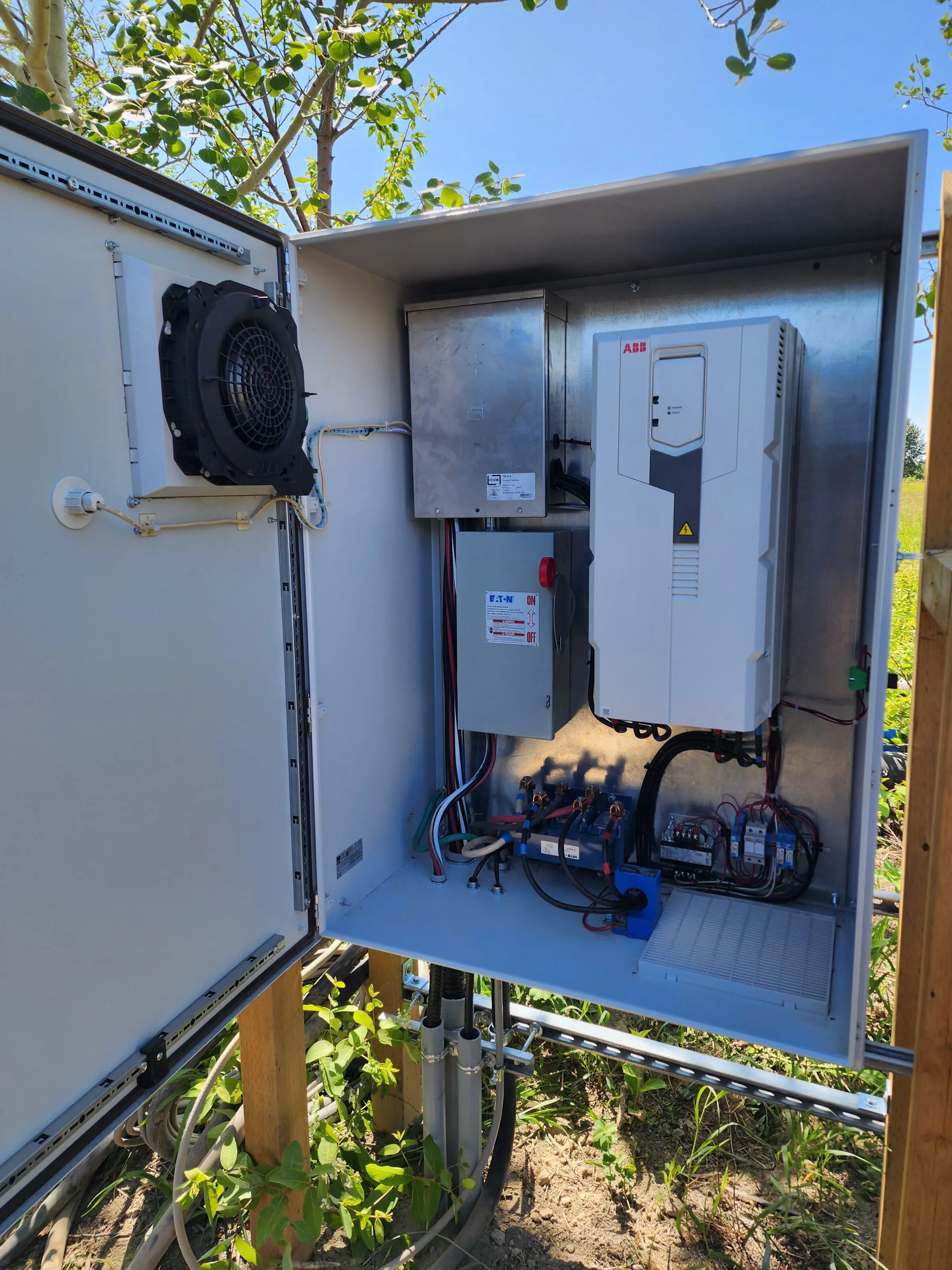 Variable frequency drive and disconnect inside an outdoor pump control enclosure