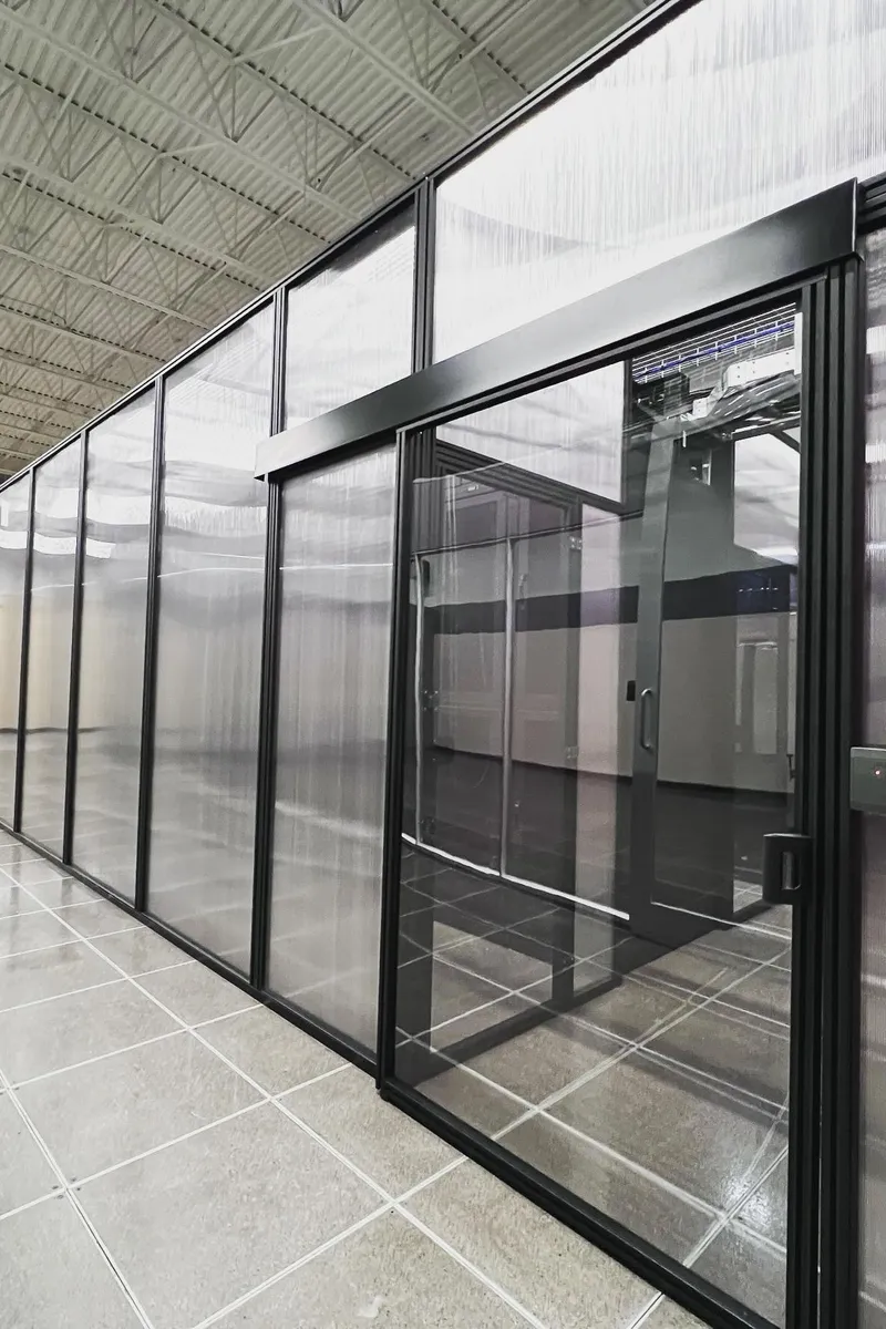 Card-access sliding glass door securing a private data center suite