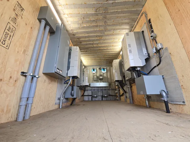 363A ABB variable frequency drives lining both walls of the container electrical room