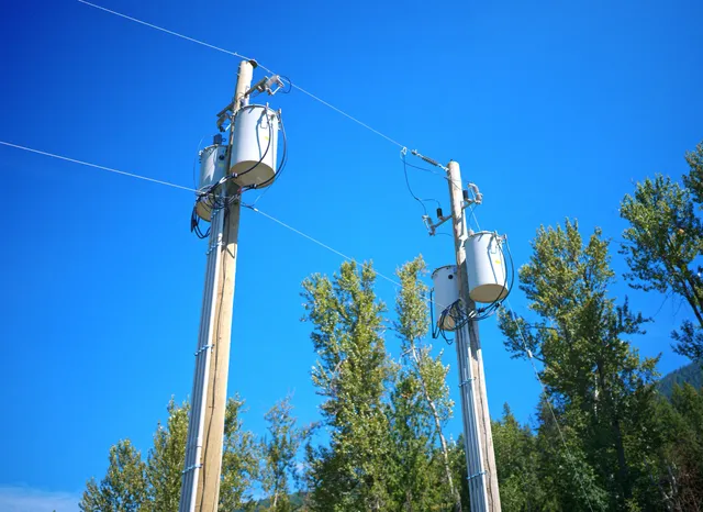Pole-mounted transformer banks feeding the four overhead services