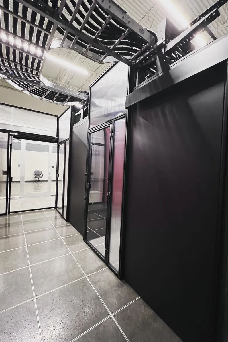 Data center white space with server cabinets and overhead cable tray infrastructure