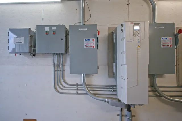 Motor control wall with soft starters, disconnects and the booster VFD inside the pump station