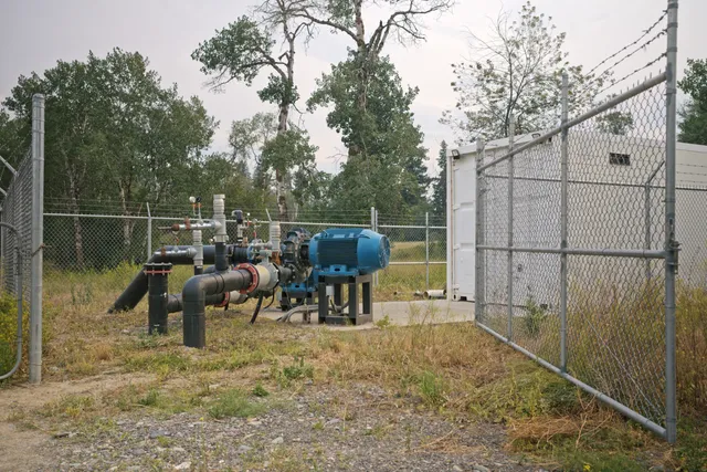 Centrifugal booster pump and controls kiosk at the fenced booster station