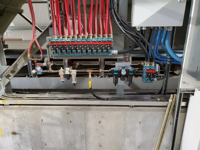 Instrumentation and pneumatic manifold serving the weigh scale bins