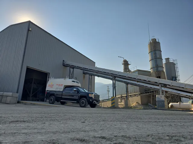 Dayton Power service truck at the Salmon Arm Ready Mix plant, under the aggregate conveyors