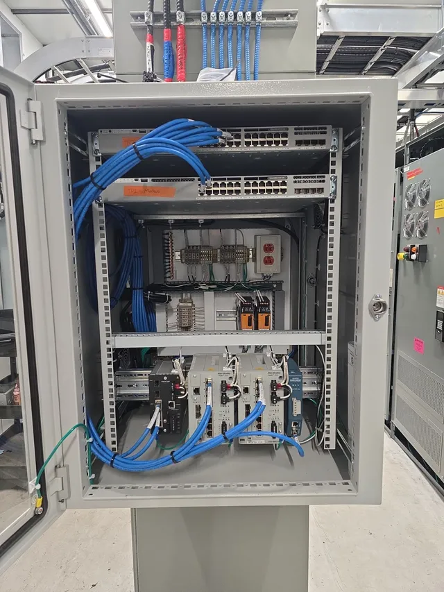 Network cabinet with switching and communications gear for the E-House