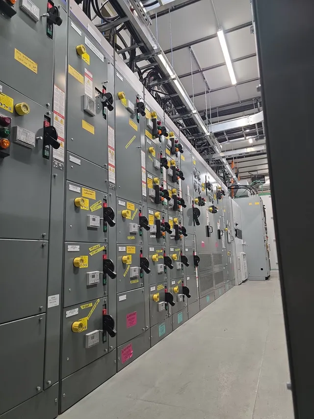 The motor control centre lineup with lockout-tagged disconnects