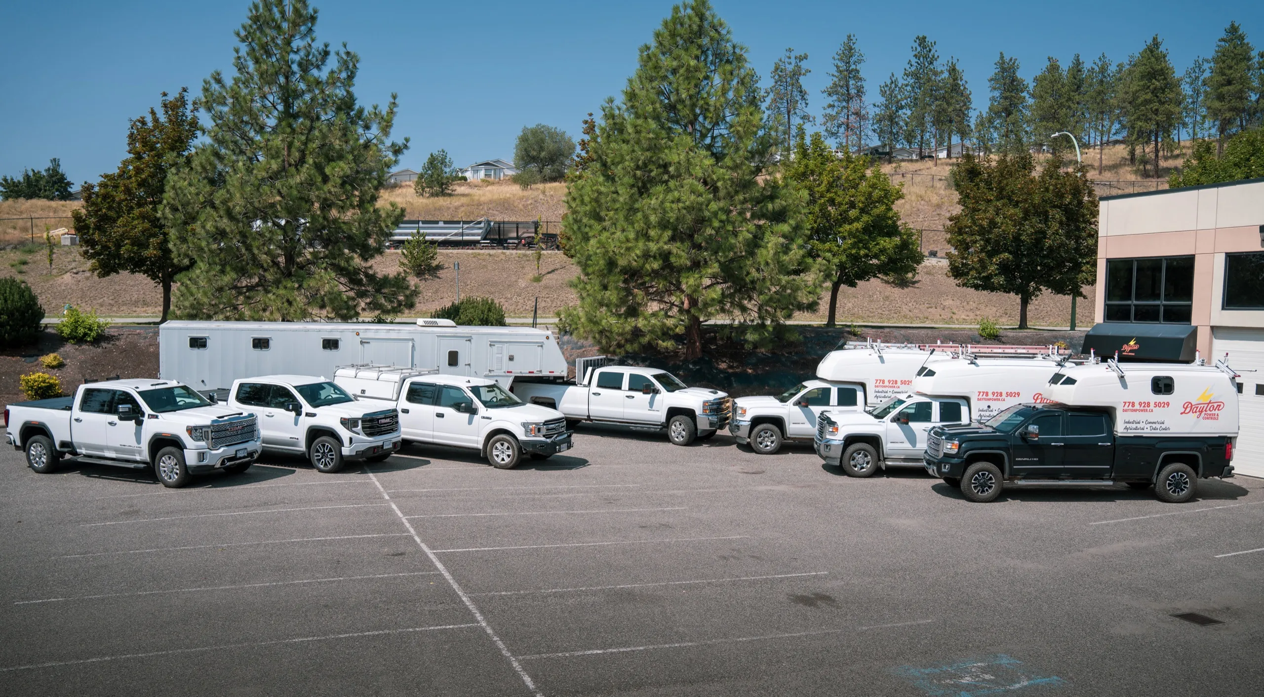 Dayton Power & Controls fleet of branded service trucks parked outside the company shop in Kelowna, BC